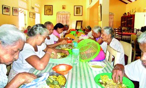 Residents enjoying a meal together indoors